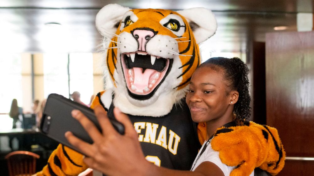 Golden Tiger Mascot HJ and student